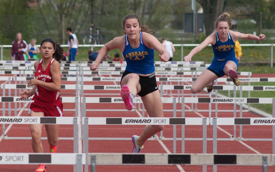 Ansbach's Hannah Shedden beat out Kaiserslautern's Sayana Lopes and fellow Cougar Alona Wright for the first place in the 100 meter hurdles. Shedden, center, crossed the finish line with 17.01 seconds.