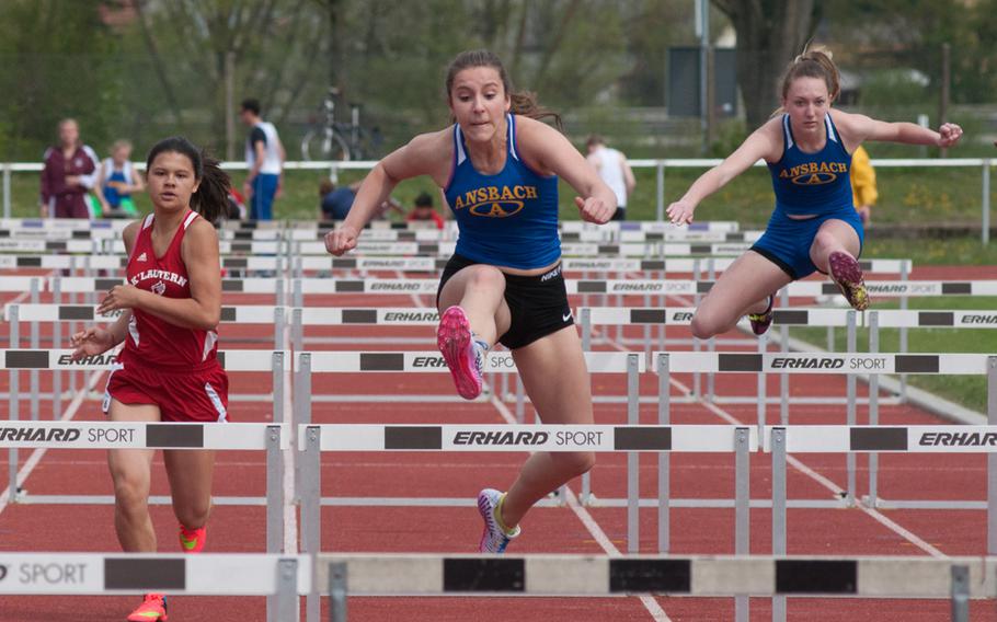 Ansbach's Hannah Shedden beat out Kaiserslautern's Sayana Lopes and fellow Cougar Alona Wright for the first place in the 100 meter hurdles. Shedden, center, crossed the finish line with 17.01 seconds. 