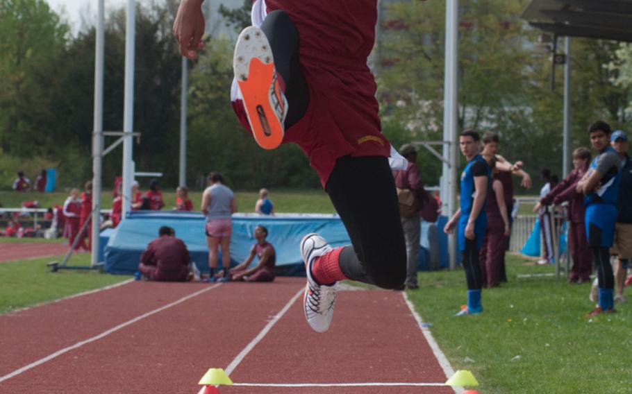 Baumholder's Treyvante Kendrick gets some air during the triple jump at a DODDS-Europe track meet held in Regensburg, Germany, April 25, 2015. 
