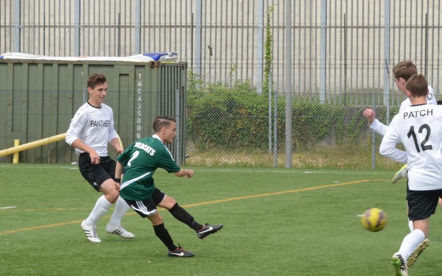 Naples' Davide Di Costanzo kicks the ball past Patch defenders for a goal Saturday at Vicenza, Italy. Naples won 2-0.
