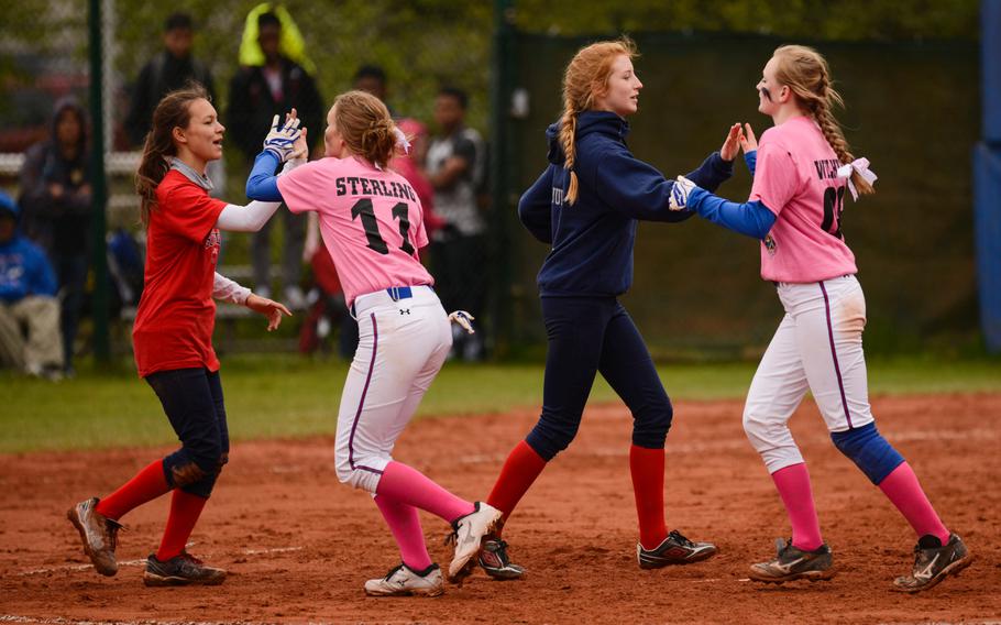 Ramstein and Lakenheath shake hands after the first game of their doubleheader on Friday, May 1, 2015 at Ramstein, Germany.