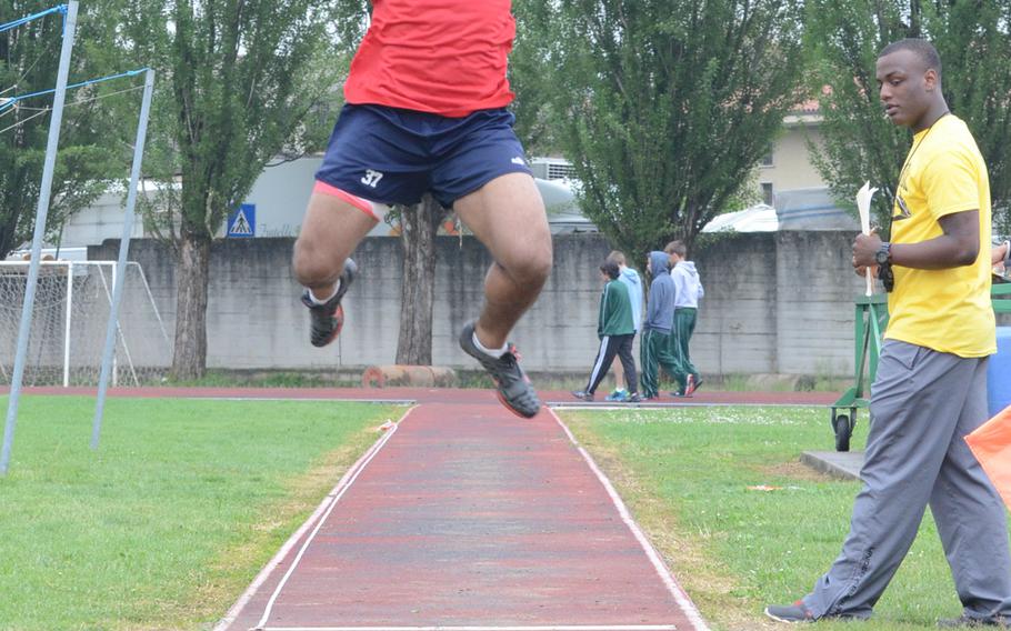 Aviano's Dimitri Dawson attempts a long jump Saturday at Creazzo, Italy. Dawson made a jump of 19 feet to take first place.
