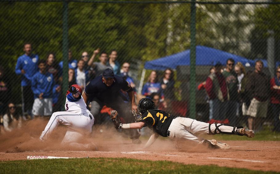 Ramstein's Antonio Ortiz slides into home to score against Patch at Ramstein, Germany, Saturday, May 9, 2015.