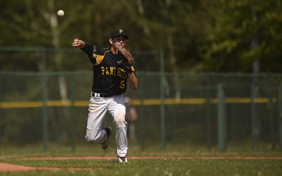 Patch's Jack Putnam throws to first for an out against Ramstein at Ramstein, Germany, Saturday, May 9, 2015.