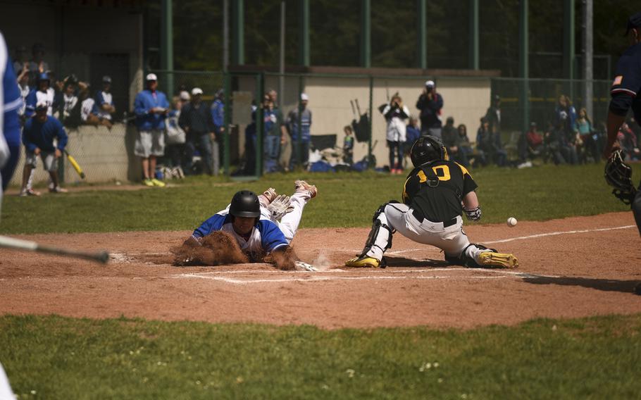 Ramstein's Ben Ciero slides into home plate against Patch at Ramstein, Germany, Saturday, May 9, 2015.

