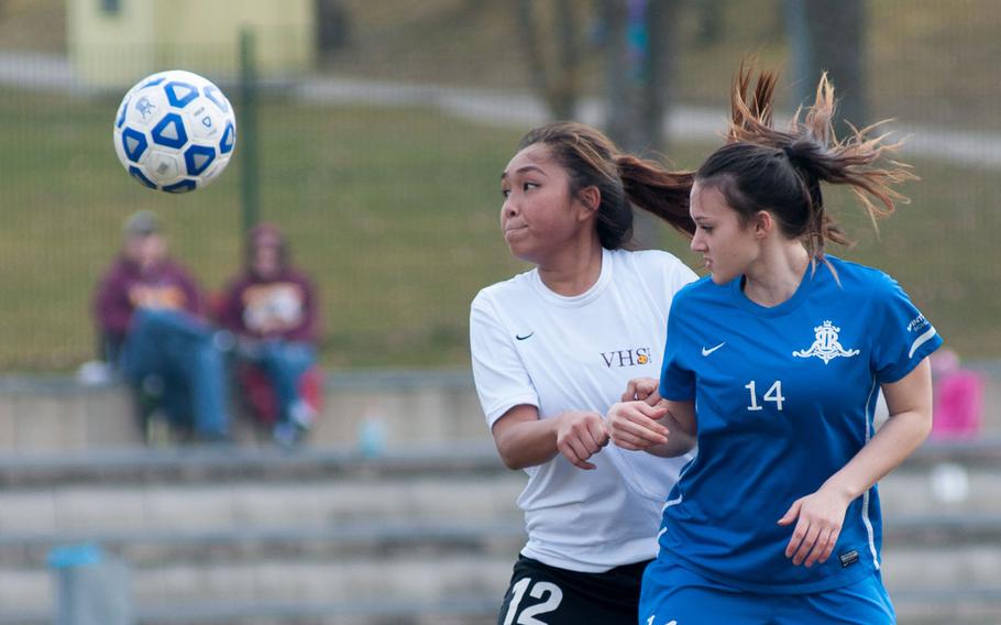 Vilseck's Kaylaah Capindo and Ramstein's Amanda Ambrose vie for a loose ball during the DODDS-Europe Division I soccer opener, Mar. 21, 2015. Ramstein won that contest 7-0. 