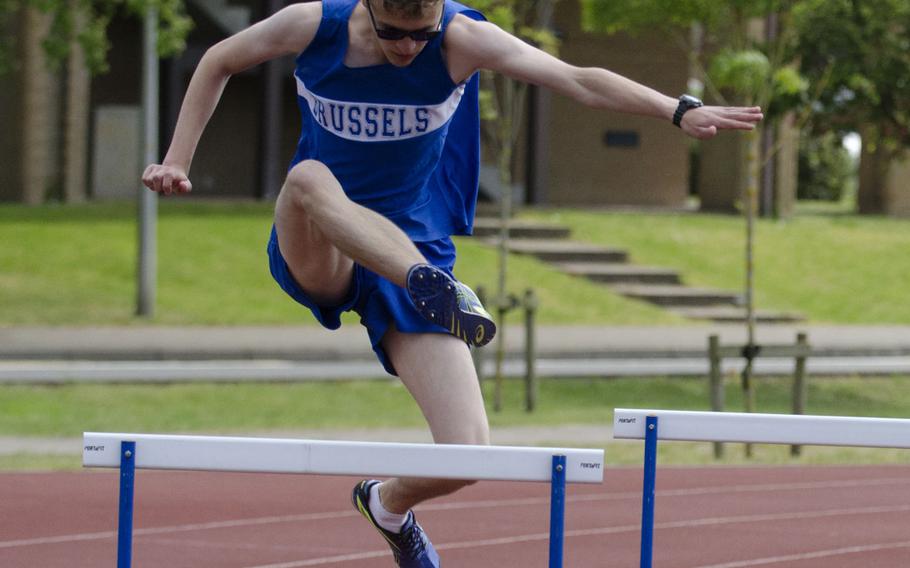 Brussels' Brandon Coleman jumps a hurdle during the 300-meter event on Saturday, May 16, 2015. Coleman placed third.