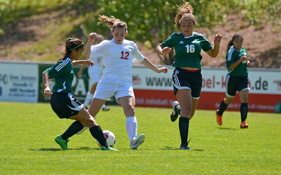 Amanda Ortega of Naples, left, gets a foot in to stop the drive of Kaiserslautern's Ariana Osmar as teammate Skylar Evans comes in to help out. Naples beat Kaiserslautern 1-0 in opening-day Division I action at the DODDS-Europe soccer finals in Reichenbach, Germany. The game ended in a 2-2 tie.
