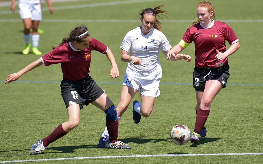 Ramstein's Amanda Ambrose gets past Vilseck's Thuraia Babel, left, and Sarah Hall in opening-day Division I action at the DODDS-Europe soccer finals in Reichenbach, Germany. Ramstein won 7-0.