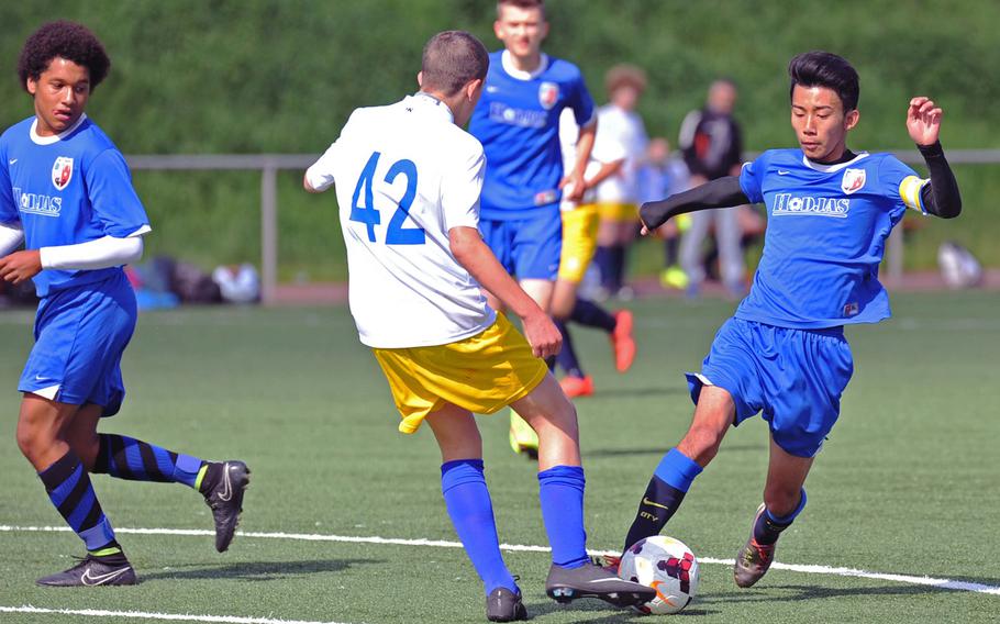 Incirlik's Yuuga Yamashiro, right, tries to get past Florence's Matteo Stocchi as teammate Alex Bautista, left, watches. Florence beat the Hodjas 4-2 in a Division III game at the DODDS-Europe soccer championships at Landstuhl, Germany. 