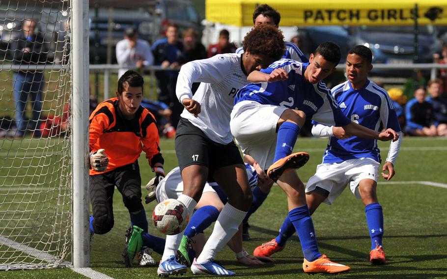 Wiesbaden's Daniel Scahill tries to keep Patch's Micah Williams from scoring as Wiesbaden keeper Matias Chavez gets ready to pounce on the ball in a Division I game at Reichenbach, Germany. The game, at the DODDS-Europe soccer championships ended 1-1.