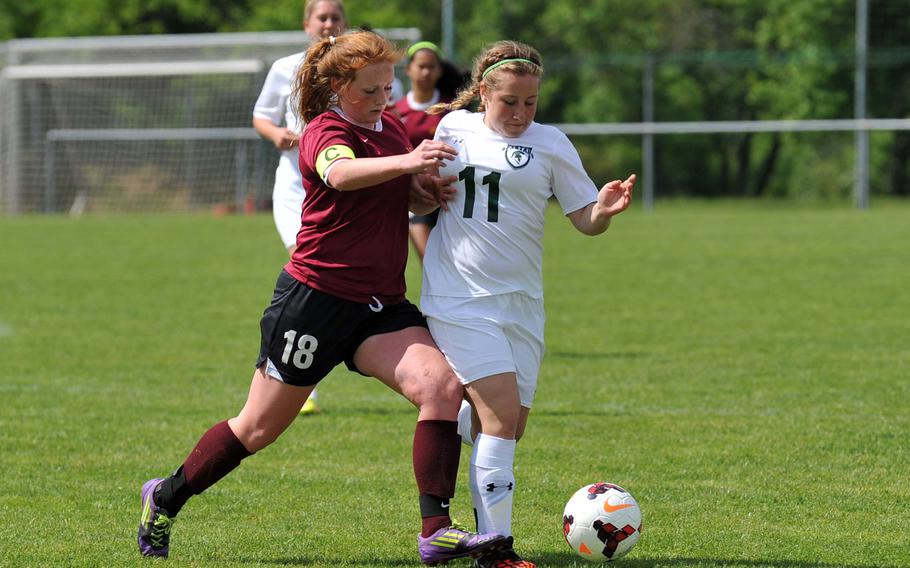 Vilseck's Sarah Hall, left, and SHAPE's Sydney Greenfield fight for the ball in a Division I game at the DODDS-Europe soccer finals in Reichenbach that ended in a 1-1 tie.