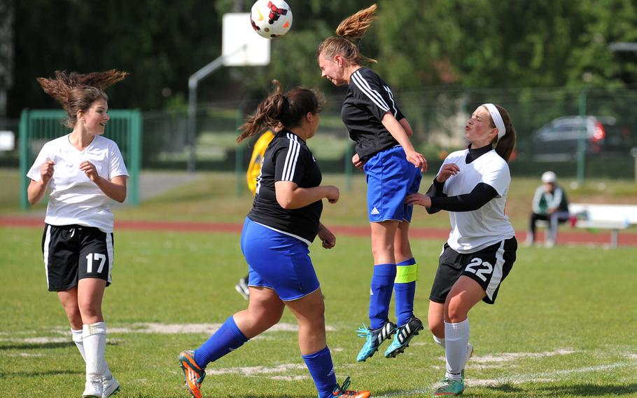 Hohenfels' Shelby Atkinson heads the ball out of danger in front of AFNORTH's Sarah Phillips, right, in a Division II game at the DODDS-Europe soccer championships in Ramstein, Germany. The game ended in a 1-1 tie.