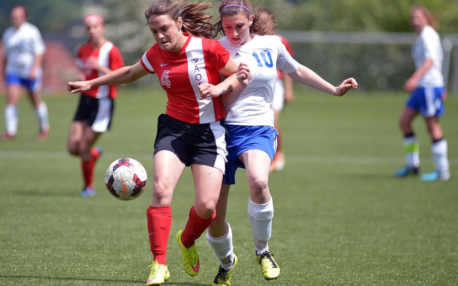 American Overseas School of Rome's Donna Mobili, left, and Hohenfels' Amelia Heath fight for the ball in a Division II semifinal at the DODDS-Europe soccer championships at Reichenbach, Germany. Hohenfels won the game 3-0 to advance to Thursday's final against AFNORTH.
