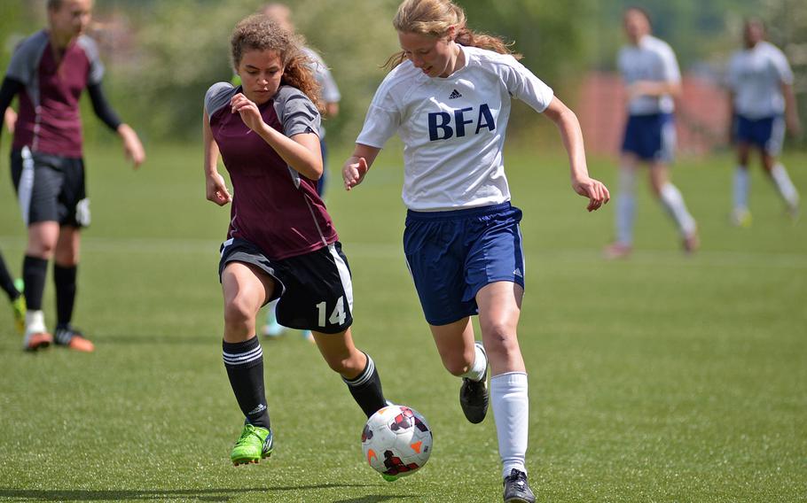 AFNORTH's Amanda McCauley, left, chases Black Forest Academy's Anna Kragt in a Division II semifinal at the DODDS-Europe soccer championships at Reichenbach, Germany. AFNORTH won the game 1-0 in overtime to advance to Thursday's final against Hohenfels.
