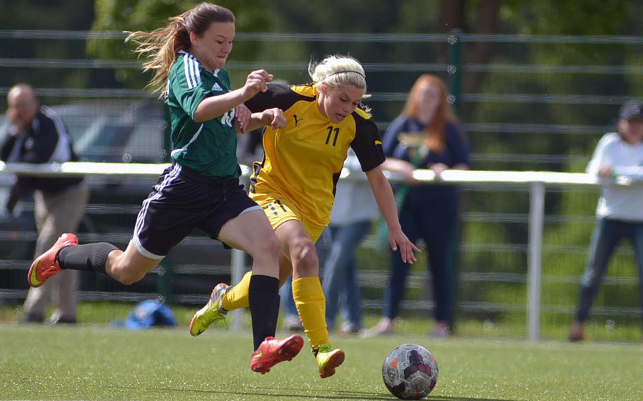 Naples' Nora Bair, left, defends against Patch's Kaitlyn Farrar in a Division I semifinal at the DODDS-Europe soccer championships at Reichenbach, Germany. Patch won the game 4-0.