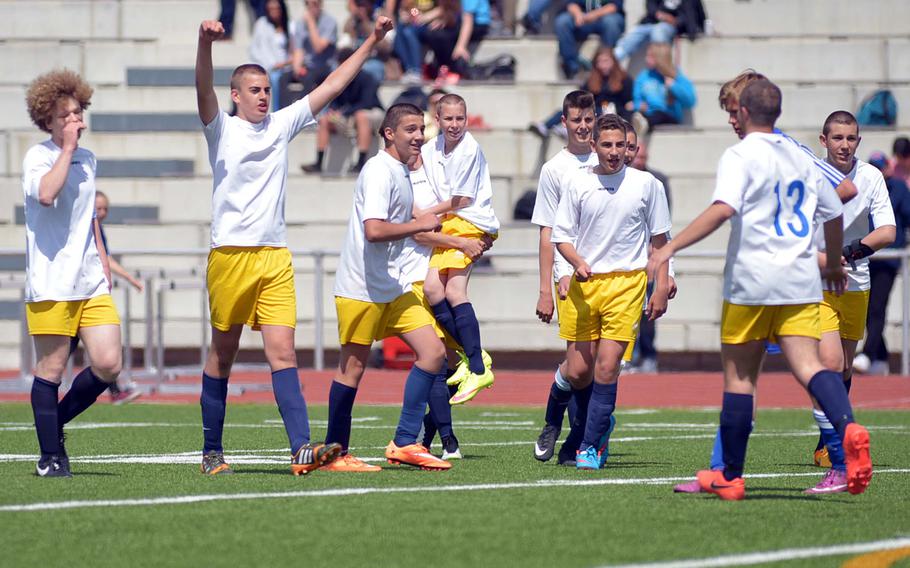 International School of Florence players celebrate their 4-0 win over Sigonella in the boys Division III final at the DODDS-Europe soccer championships in Kaiserslautern, Germany.