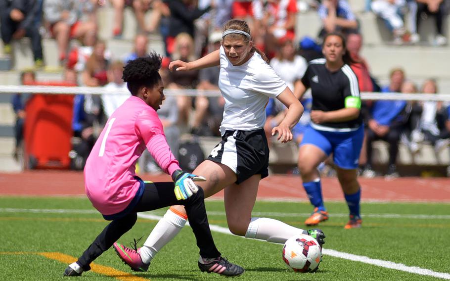 AFNORTH's Grace Phillips tries to get the ball past Hohenfels keeper Maia McDaniels in the girls Division II final at the DODDS-Europe soccer championships in Kaiserslautern, Germany. Hohenfels beat AFNORTH 1-0.