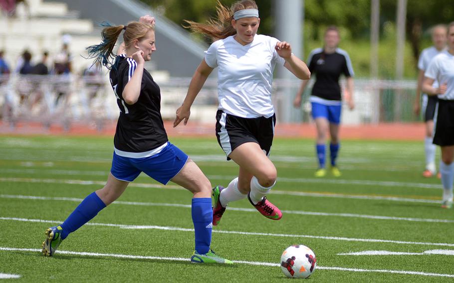 AFNORTH's Grace Phillips, right, tries to get past Hohenfels' Tanja Vass in the girls Division II final at the DODDS-Europe soccer championships in Kaiserslautern, Germany. Hohenfels won 1-0.
