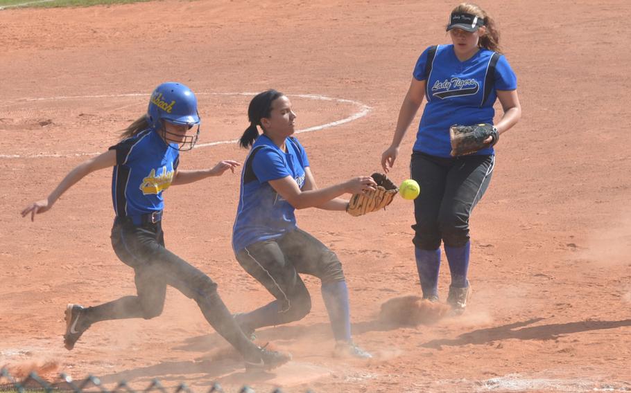 Ansbach's Andrea Randall beats out an infield grounder for a base hit against Hohenfels during a Division II championship tournament game.
