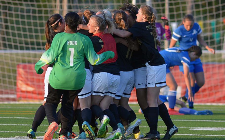 The Patch Panthers players celebrate their winning the girls Division I championship, beating Ramstein 2-1 in overtime at the DODDS-Europe soccer championships in Kaiserslautern, Germany.