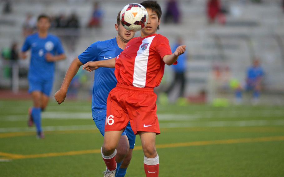 International School of Brussels' Ryota Nakamura controls the ball in front of Ramstein's Dillon Thompson in the boys Division I final at the DODDS-Europe soccer championships in Kaiserslautern, Germany. Ramstein won 1-0.