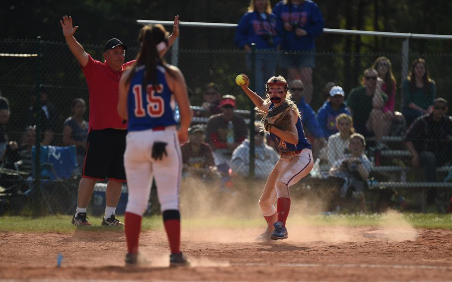 After tagging the bag, Ramstein's Sierra Nelson looks for a double play opportunity in the last inning against Kaiserslautern in pool play at the DODDS-Europe softball championships.
