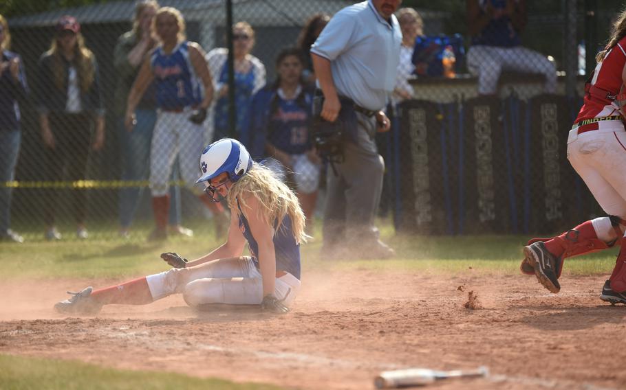 Ramstein's Sierra Nelson slides homes safely in her team's stunning pool-play loss to Kaiserslautern Friday in the DODDS-Europe softball championship. 