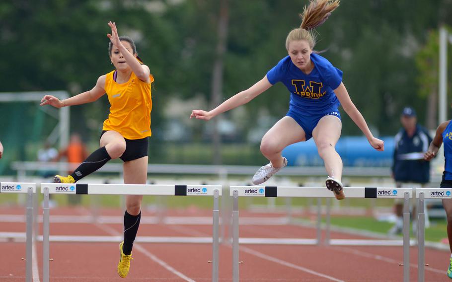 Wiesbaden's Brigantia O'Sadnick, right, won the girls 300-meter hurdles in 49.55 seconds, ahead of Frankfurt International School's Isabelle Kern, who clocked a 49.58 in a close race at the DODDS-Europe track and field championships in Kaiserslautern, Germany, Saturday, May 23, 2015.
