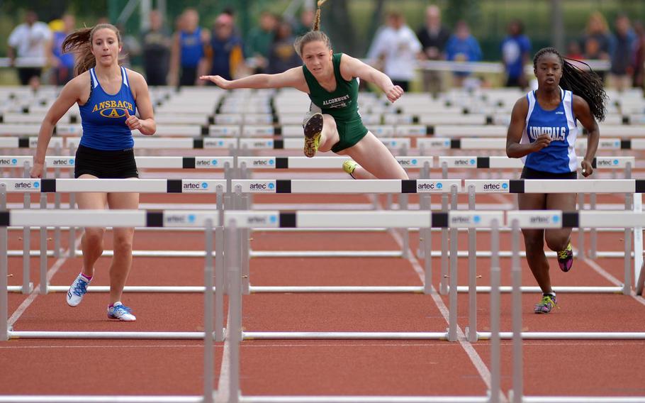 Alconbury's Olivia Sealey heads for the last hurdle on her way to winning the 100-meter hurdle event in16.63 seconds at the DODDS-Europe track and field championships in Kaiserslautern, Germany, Saturday, May 23, 2015. At left is Ansbach's Hannah Shedden who finished second, at right is Rota's Marquetta Magwood who was fourth.