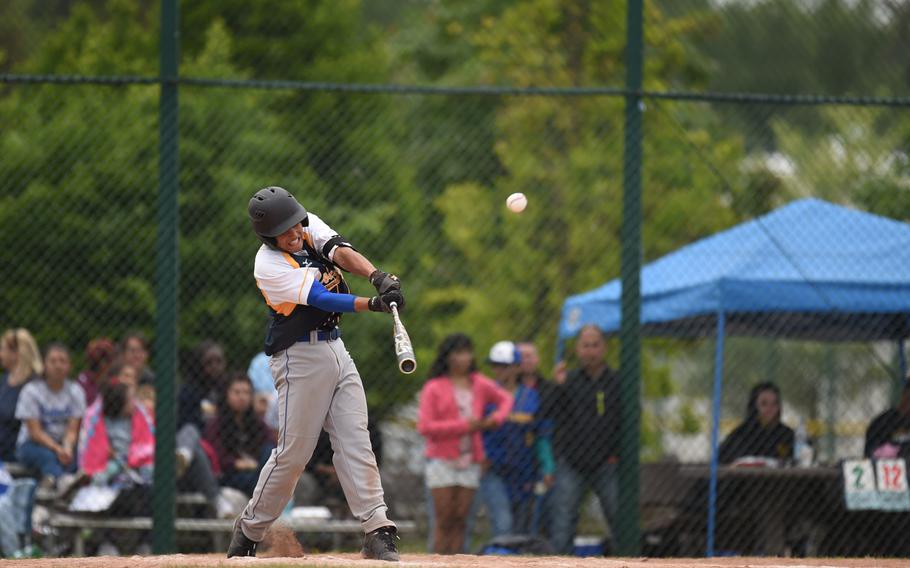 Ansbach's Yadiel Rodriguez hits a pop-fly single in the Cougars' 12-5 loss to Rota in the DODDS-Europe Division II/III final Saturday at Ramstein Air Base.