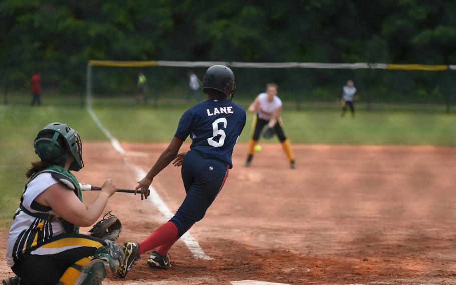 Aviano senior Shamera Lane hits a grounder to third in the Saints' 8-3 win over Alconbury for the DODDS-Europe Division II/III softball crown.