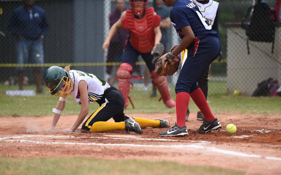 Alconbury sophomore Josie Whitaker sweeps her foot toward the plate stealing home in the Dragons' 8-3 loss against Aviano in the DODDS-Europe Division II/III title game.