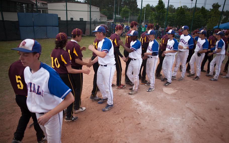 DODDS-Europe Division I champions Ramstein and runners-up Vilseck shake hands after the Royals' 27-1 victory.
