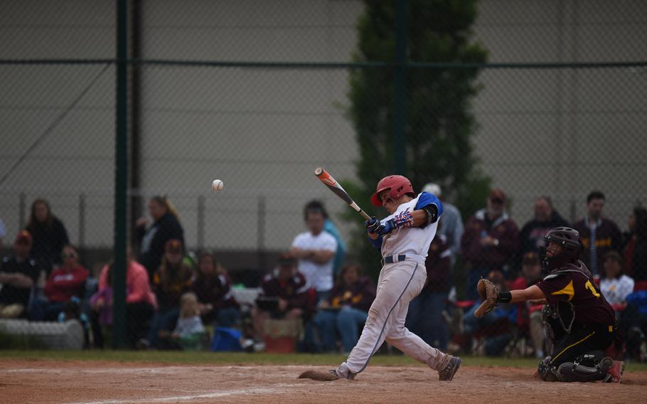 Ramstein's Antonio Ortiz drives one to left field for an out in the Royals' 27-1 romp over Vilseck for the 2015 DODDS-Europe Division I baseball title.