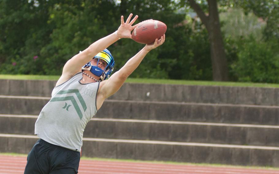 Tyler Benton, Ansbach's All-Europe middle linebacker, extends out for a catch in the end zone during a 7-on-7 drill, June 13, 2015. 