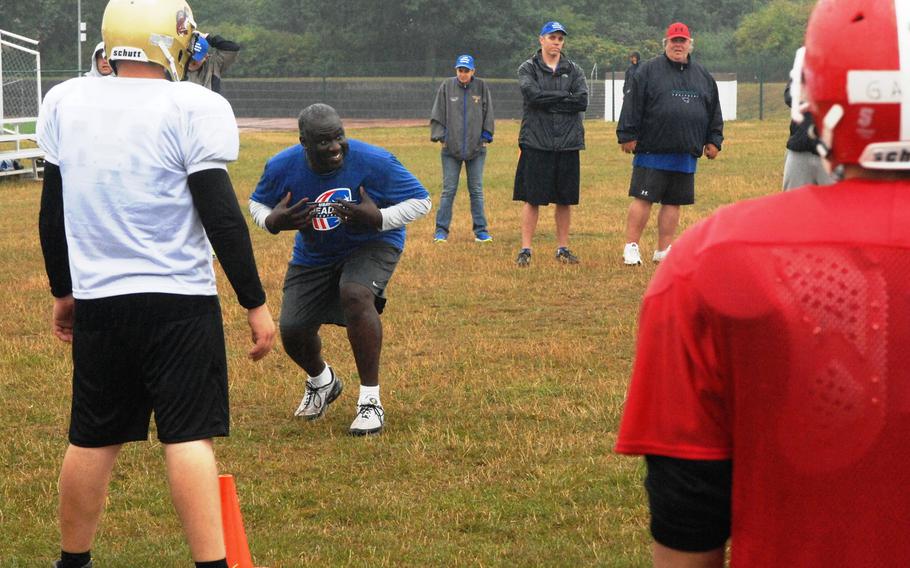 Former NFL defensive lineman Michael Haynes addresses campers at the European Football Camp on Monday, Aug. 17, 2015 at Ansbach High School on Katterbach Kaserne in Ansbach, Germany. Haynes was a first-round draft pick of the Chicazgo Bears in 2003 and played five seasons in the NFL. 
