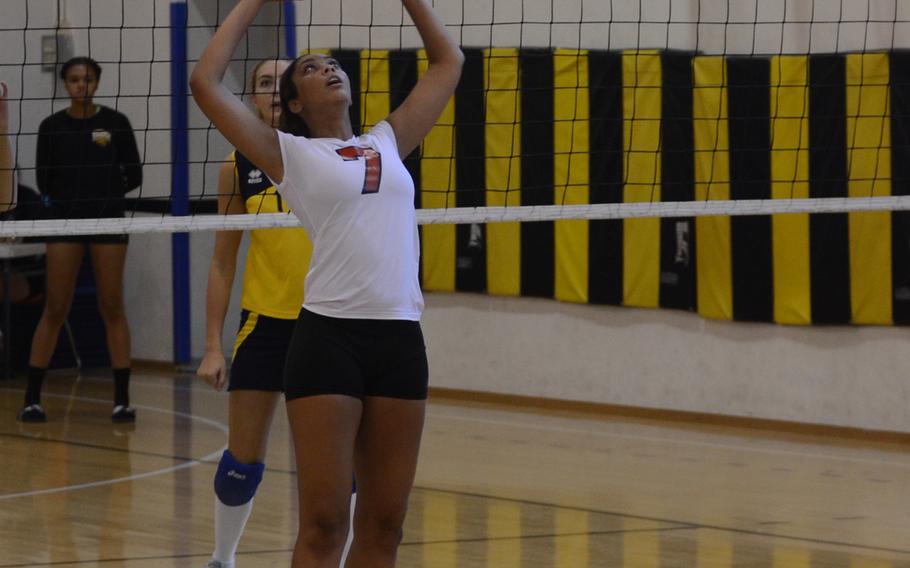 Aviano's Viyanni Johnson sets the ball Saturday, during a volleyball match against Florence at Vicenza, Italy. The Wild Boars swept the Saints, 25-20, 25-18, 25-23. 