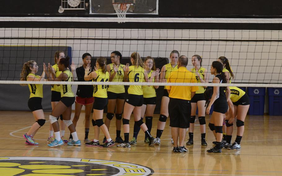 The Vicenza Cougars celebrate after sweeping Aviano on Saturday at Vicenza, Italy. The Cougars won 25-9, 25-10, 25-12.