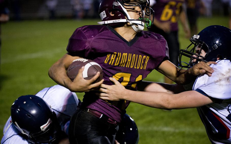 Baumholder's Solo Turgeon breaks through a tackle against Bitburg's defense in Baumholder, Germany, Friday, Sept. 25, 2015. Baumholder lost the game 46-0. 