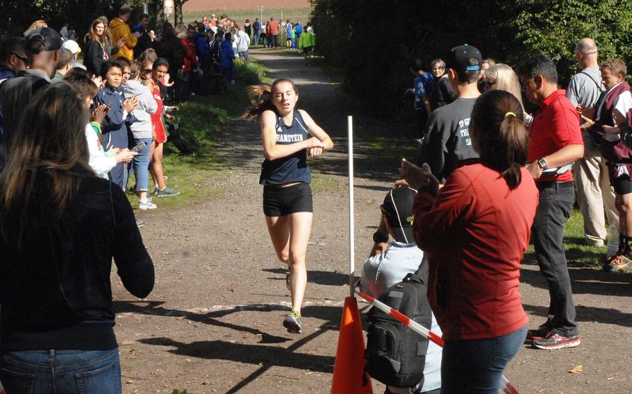 Ramstein's Katelyn Schultz crosses the finish line first in a six-school girls cross country race Saturday, Sept. 26, 2015, at Ramstein-Miesenbach, Germany. Schultz recorded a winning time of 20 minutes, 21.96 seconds. 