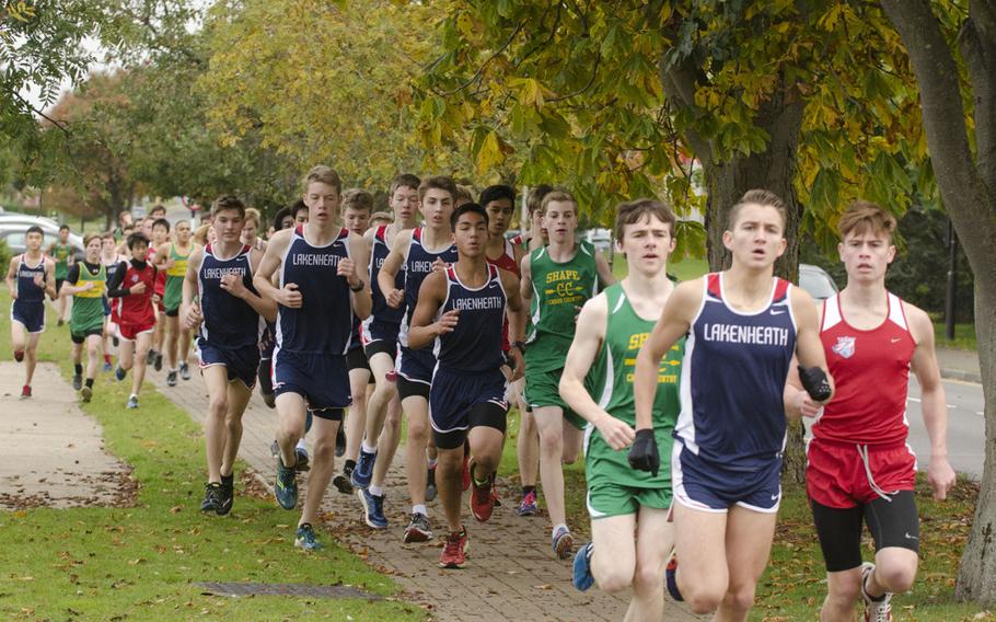 Boys run the first lap during a cross country meet at RAF Lakenheath on Saturday, Oct. 17, 2015. Lakenheath's Austin Burt came in first with a time of 17 minutes, 45 seconds.