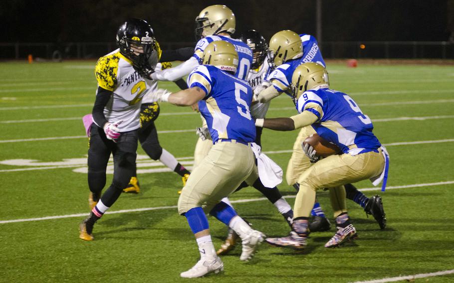 Deshon Barrow, a senior running back for Wiesbaden, looks for room on a sweep during the second quarter of his team's game against Stuttgart on Friday, Oct. 23, 2015 in Wiesbaden, Germany. Both teams came in with 2-2 records, but Wiesbaden's 14-10 victory at home ensured it would advance to the DODDS-Europe Division I playoffs next week.
