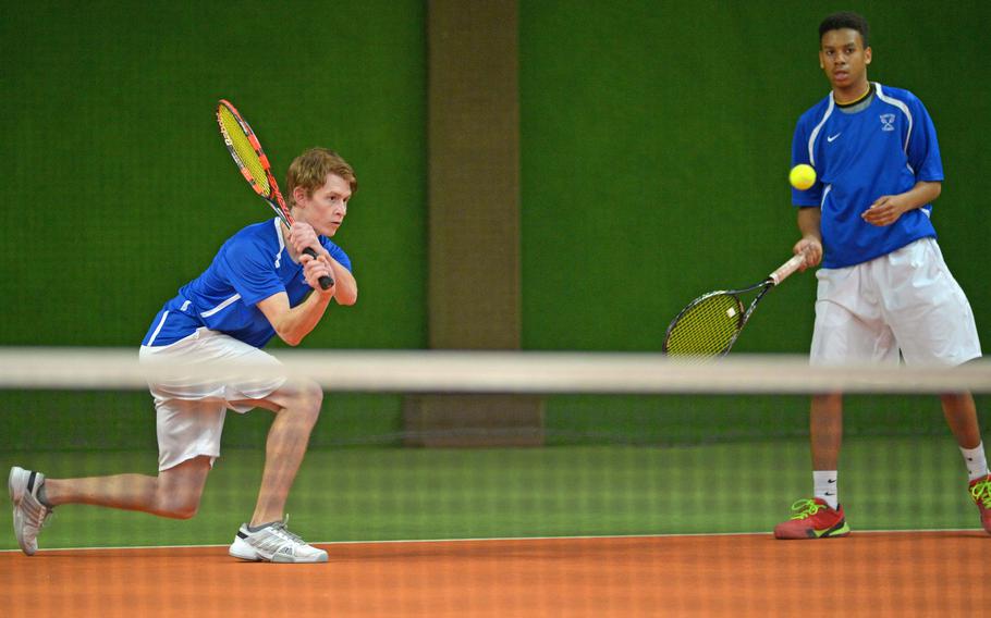 Ramstein's Logan Beckmann, left, and Lance Daley watch Beckmann's shot against Bahrain fly across the net in a second-round doubles match at the DODDS-Europe tennis championships in Wiesbaden, Germany, Oct. 29, 2015. . The Ramstein pair lost to Frank Li and Moustafa Refai 6-4, 7-5.