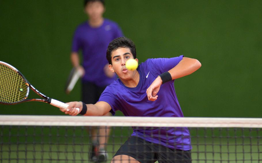 Bahrain's Moustafa Refai keeps his eye on the ball as he returns a Ramstein ball at the net in a second-round doubles match at the DODDS-Europe tennis championships in Wiesbaden, Germany, Oct. 29, 2015. Refai and teammate Frank Li defeated Ramstein's Logan Beckmann and Lance Daley 6-4, 7-5.