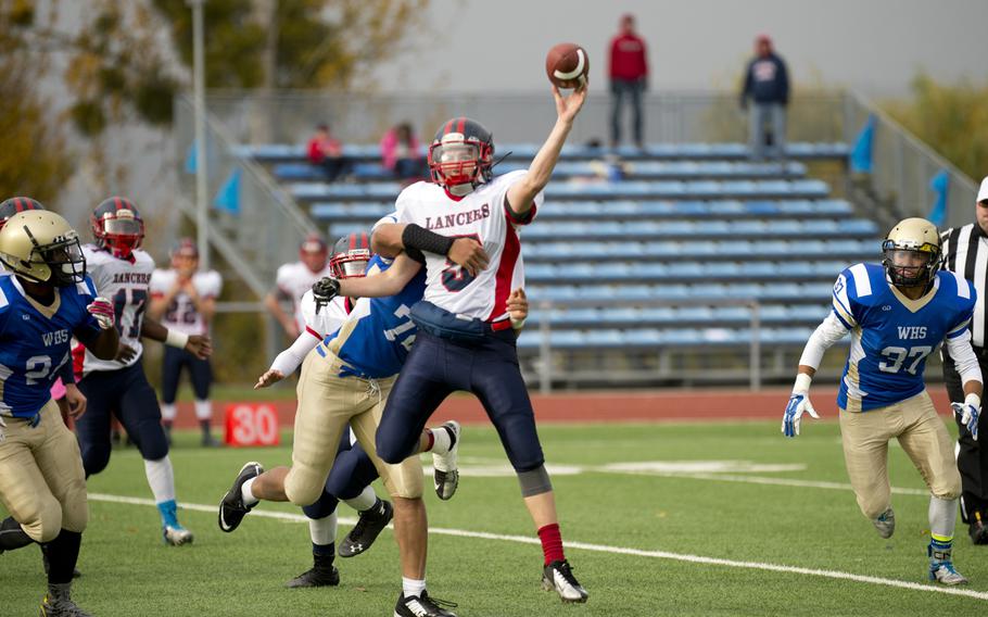 Lakenheath Lancer Riley Palmer throws a pass during the DODDS-Europe Division I football semifinals at Wiesbaden, Germany, on Saturday, Oct. 31, 2015. Despite scoring two touchdowns in the fourth quarter, the visiting Lancers still lost to the Wiesbaden Warriors 27-16.