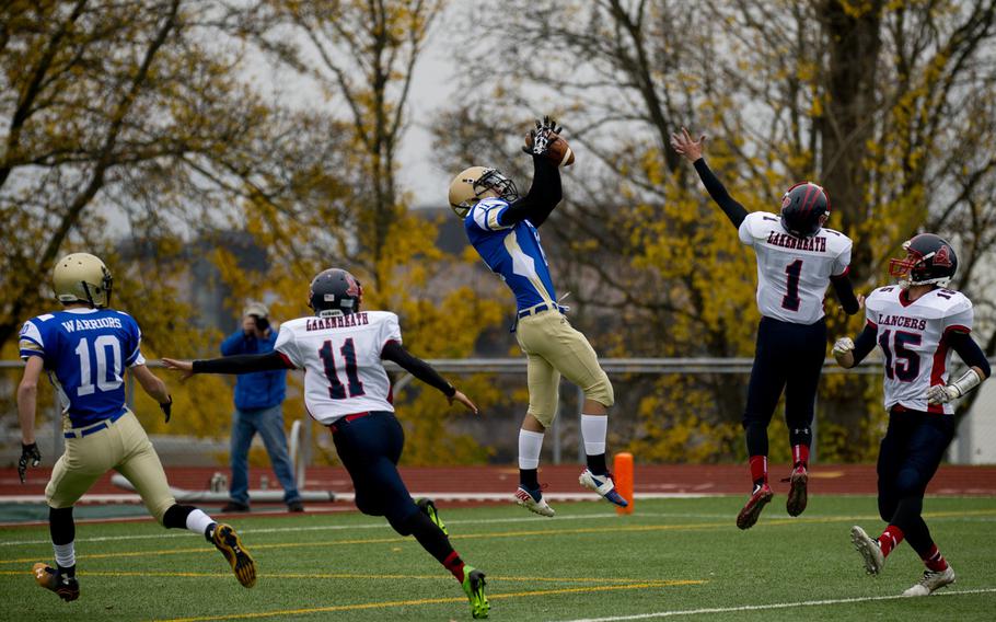 Wiesbaden Warrior Liam Steininger catches a touchdown pass during the DODDS-Europe Division I football semifinals at Wiesbaden, Germany, on Saturday, Oct. 31, 2015. Steininger's touchdown helped the Warriors beat the visiting Lakenheath Lancers 27-16.