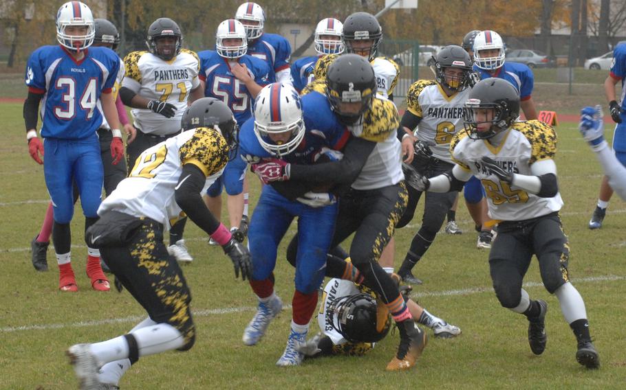 Ramstein running back Sid Boggs powers through a Stuttgart tackle in the Stuttgart Panthers' 10-8 defeat of the Ramstein Royals on Saturday, Oct. 31, 2015.