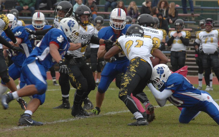 Ramstein tackler Joshua Harris grasps at Stuttgart running back Myles Bryant in the Panthers' 10-8 defeat of the Ramstein Royals on Saturday, Oct. 31, 2015.
