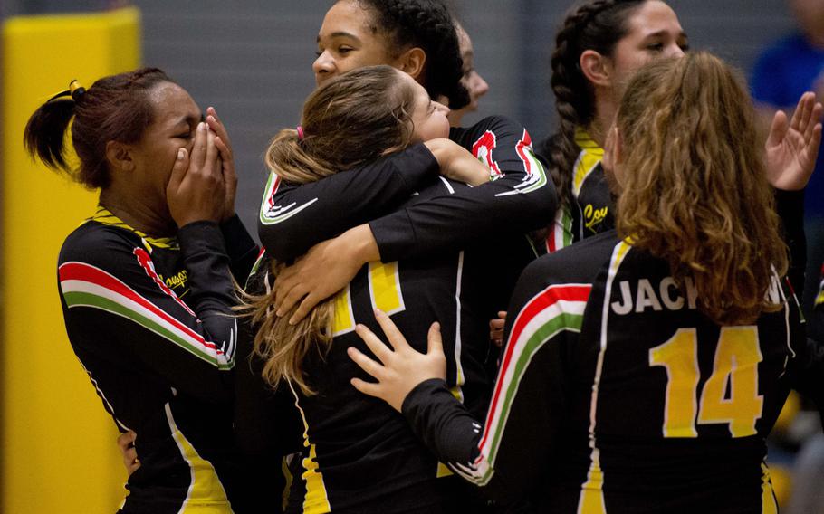The Vicenza Cougars celebrate after defeating the Wiesbaden Warriors during a DODDS-Europe semifinal match at Ramstein Air Base, Germany, on Friday, Nov. 6, 2015. The Cougars defeated the Warriors 22-25, 26-24, 25-22, 15-25 and 15-9.